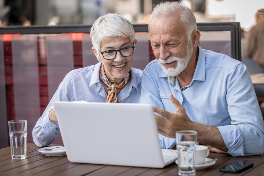 senior couple and laptop