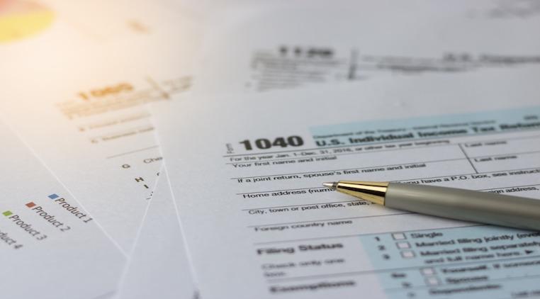 1040 tax form with pen